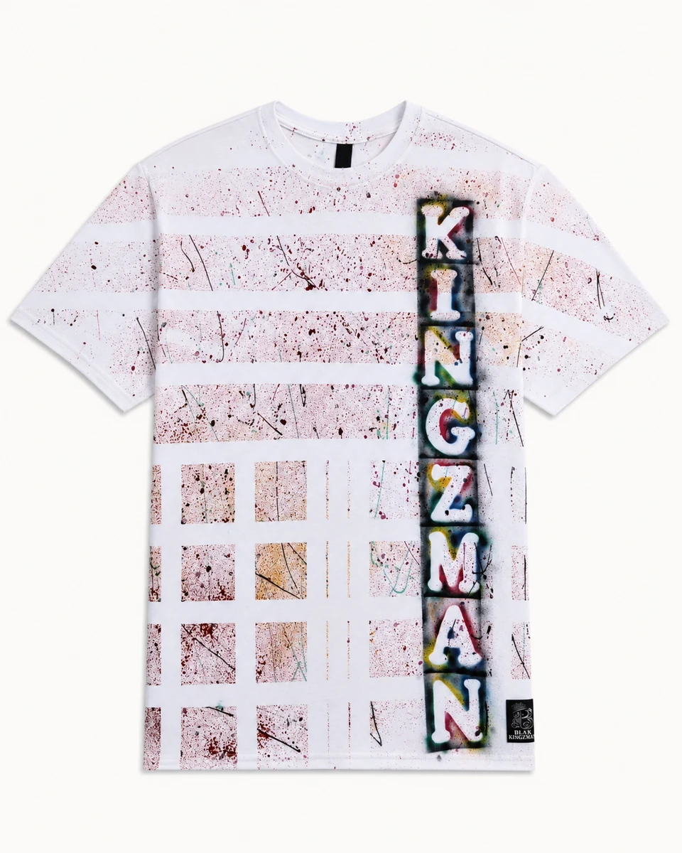 BLAK KINGZMAN Grid Spray-Paint Tee — white grid pattern all-over print with KINGZMAN vertical spray lettering in multicolor